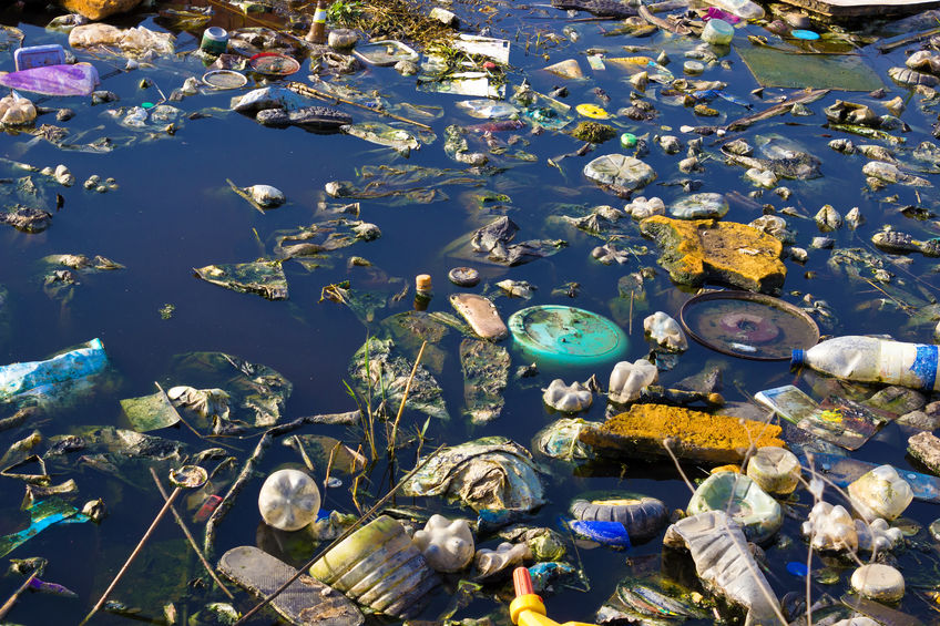 27354675 - river that is polluted with various garbage and trash, polluted rivers, photography